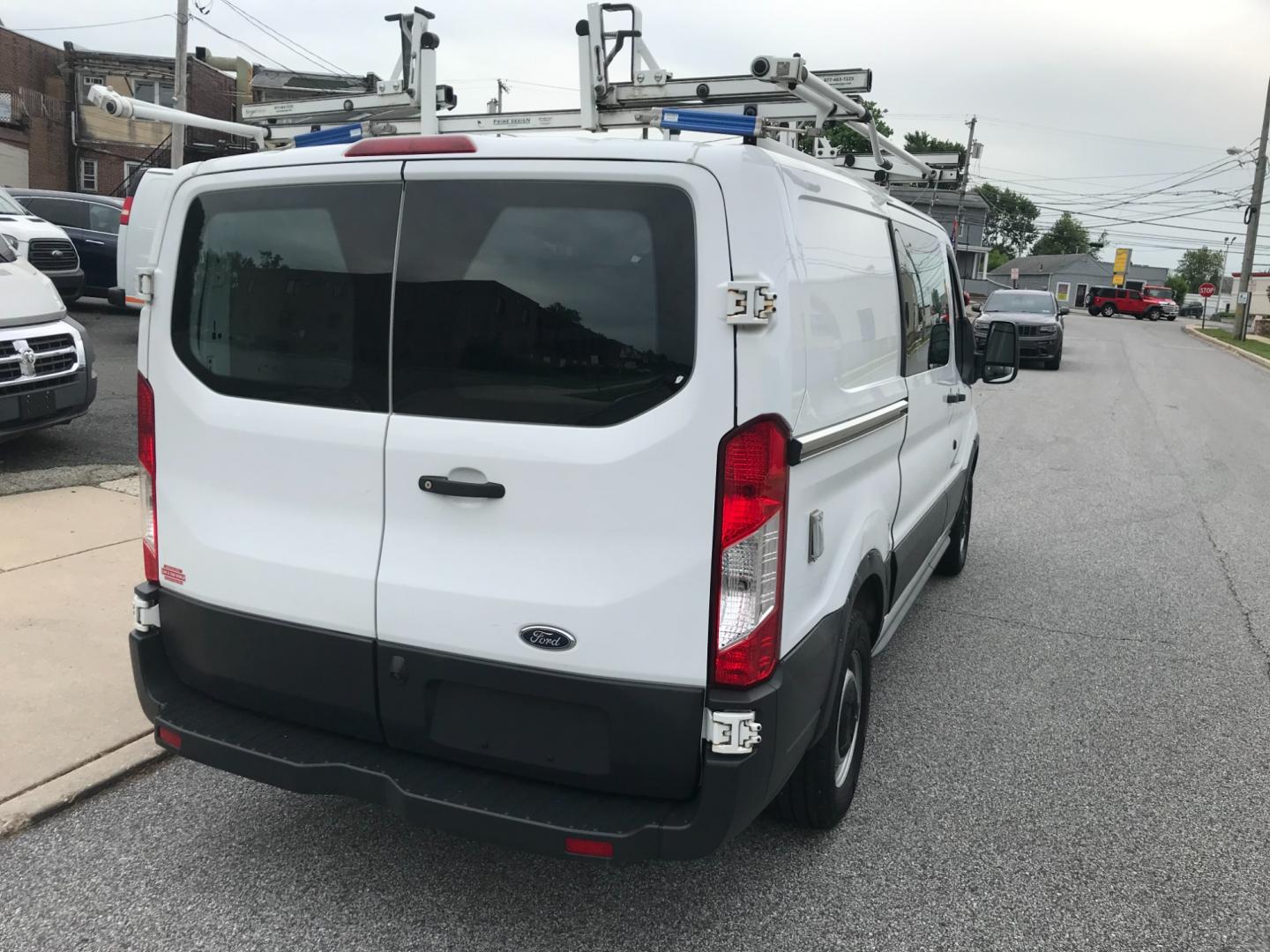 2018 White /Gray Ford Transit 150 (1FTYE1YM1JK) with an 3.7 V6 engine, Automatic transmission, located at 577 Chester Pike, Prospect Park, PA, 19076, (610) 237-1015, 39.886154, -75.302338 - 2018 Ford Transit 150: Dual drop down ladder racks, multiple pieces of shelving, power inverter w/ outlet, heavy duty partition, FLEET MAINTAINED, runs LIKE NEW! This vehicle comes inspected and has been given a bumper to bumper safety check. It is very clean, reliable, and well maintained. We of - Photo#6